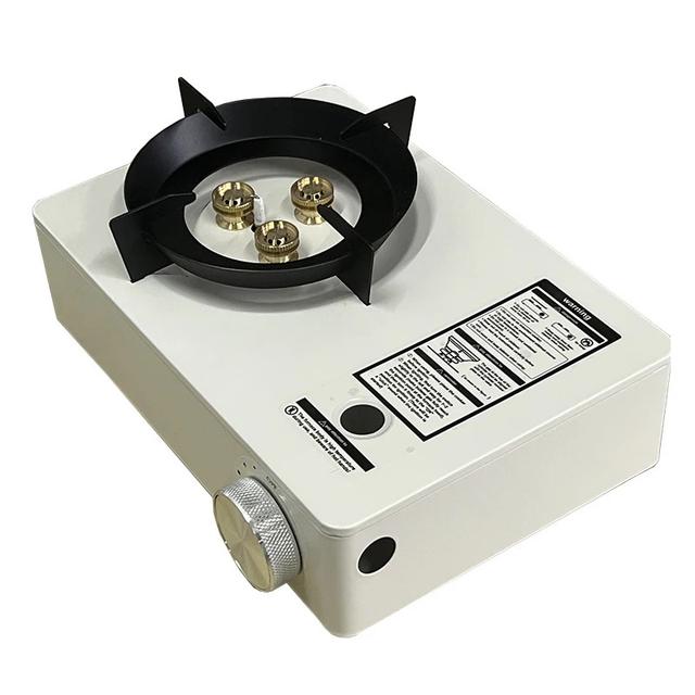 Portable gas stove with a strong flame and wind resistance, featuring even heat distribution and a bag for easy carrying